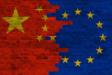 Europe Union and China flags painted on the brick wall. Trade, tariffs war and competition. Trade,...
