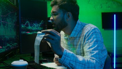 Arabian Indian man male guy programmer examining writing binary code coder freelancer engineer...