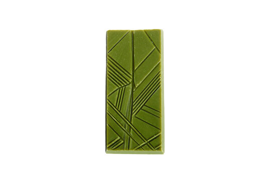 a green rectangular tile with a design of lines