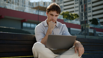 Caucasian thoughtful man thinking working laptop computer freelancer male guy businessman business...