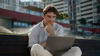 Happy Caucasian man working remote laptop computer entrepreneur smiling male guy freelancer...