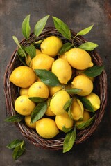 Yellow lemons ripening, green leafy branches nestling in woven wicker basket against dark rustic background, embodying fresh citrus freshness