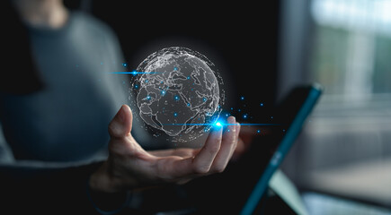 A person holds a digital holographic globe projection with network connections, symbolizing global technology and digital communication.