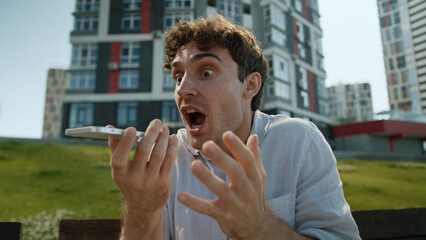 Angry Caucasian man talking mobile phone smartphone shout scream boss director quarrel conflict...