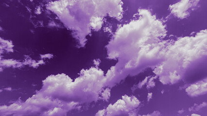 View of purple sky filled with soft, fluffy clouds on, perfect for banner background, wallpaper.