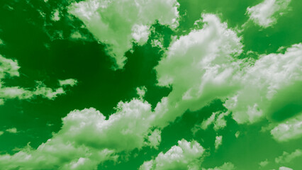 View of green sky filled with soft, fluffy clouds on, perfect for banner background, wallpaper.