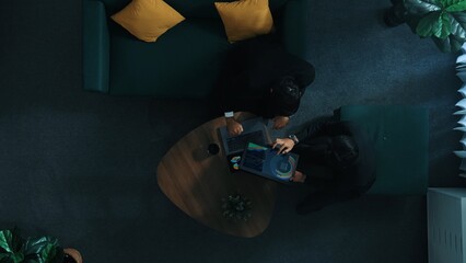 Top view of professional business people analyze stock market investment data by using laptop and...