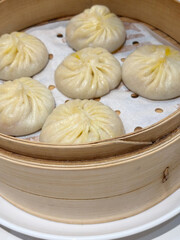 A tray of delicious xiao long bao. Also known as soup dumplings, it is a type of Chinese steamed bun filled with meat and a flavorful broth. 