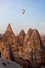 Hot air balloons over the landscape of Cappadocia, near the village of Goreme, Turkey.