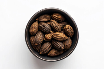 Dried Chinese Black Cardamom Pods in Dark Bowl spice