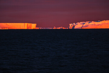 A stark image of a melting ice cap with its jagged edges contrasting sharply. Reminder of the...