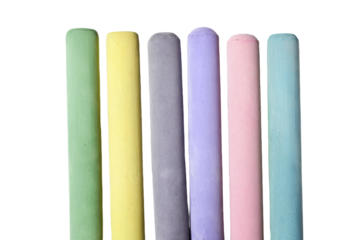 a row of colored chalk sticks on a white surface