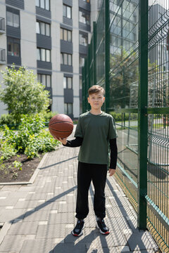 Basketball practice by urban apartment complex