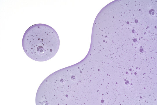 Lavender gel droplets and smooth texture on white background