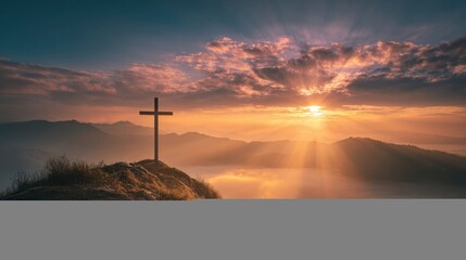 Peaceful sunrise over mountain landscape with cross on hill and colorful sky.