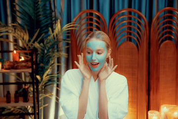 Serene ambiance of spa salon, woman customer indulges in rejuvenating with luxurious face cream...