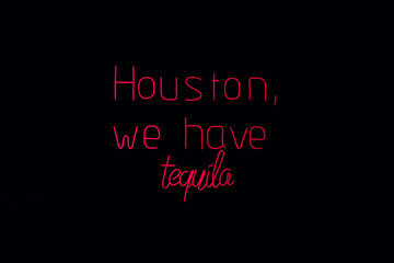 Neon text art with humorous tequila message
