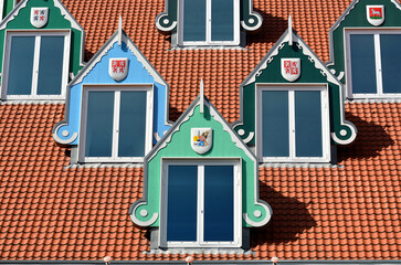 Architecture and coloured windows on the roof of the town hall in Zaandam, Netherlands.