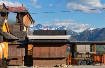 wooden kiosks against the backdrop of snow-capped mountains in Zakopane - Lesser Poland - Poland
