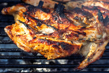 Pork chops, steak, sausages on barbecue grill