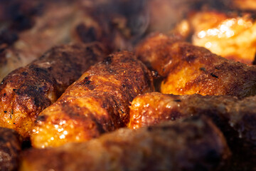 Pork chops, steak, sausages on barbecue grill