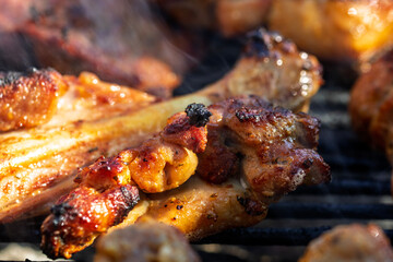 Pork chops, steak, sausages on barbecue grill