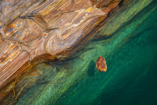 Abstract natural green water and stones of Verzasca river in Switzerland, Euurope