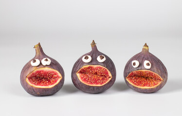 Spooky fig monsters for Halloween party on white background