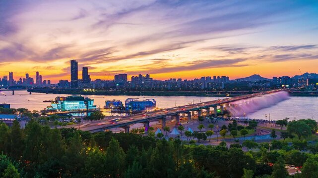Zoom in Sunset at Han River and the Rainbow Fountain at Banpo Bridge at night with beautiful lights. Romantic tourist attractions in Seoul,