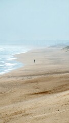 Summer beach landscape featuring a lone figure walking along the shore Generative AI
