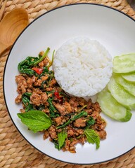 Homemade Rice topped with stir fried Thai basil with minced pork , pad ka praow moo sap