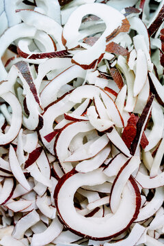 Coconut slices close up with brown shell detail