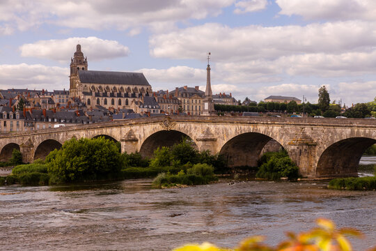 Historic bridge and skyline of Blois, France