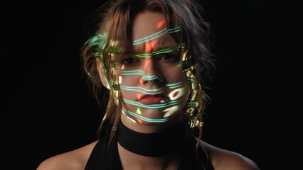 Portrait of a woman with Stock Market Data symbols projected on her face.