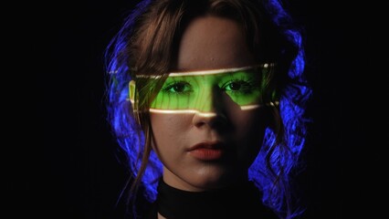Portrait of a woman with green Progress Bar Display projection on her face.