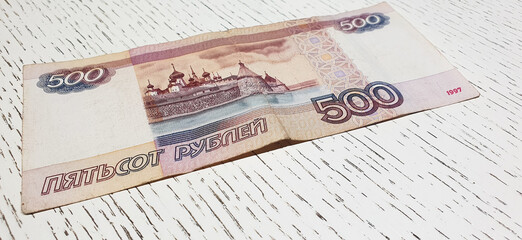 500 ruble bills on the table. Ruble banknotes, paper money, finance.