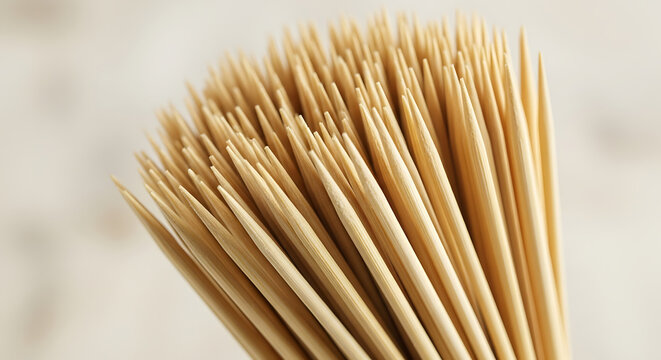 Bundle of wooden toothpicks arranged in a close-up view  