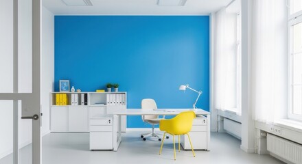 Bright office interior showcases a modern white desk, a yellow chair, and a vibrant blue accent wall, creating a clean and professional workspace environment.