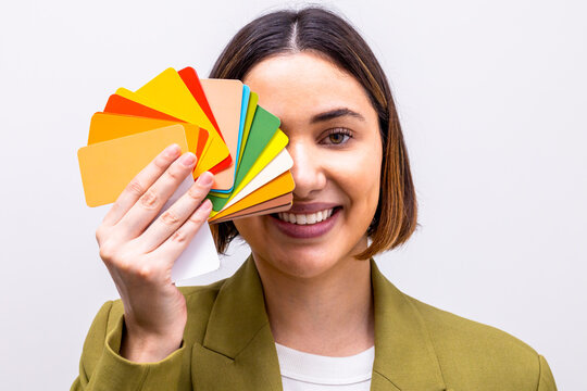 Image consultant holding a palette of colorful swatches