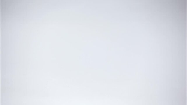 Timelapse of a declining stack of gold coins forming a downward graph, representing financial loss, economic downturn, or decreasing investment value.