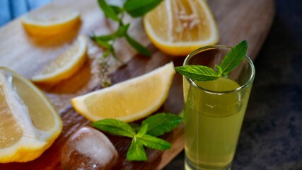 Glass of fresh homemade lemonade with lemon slices, mint, and ice cubes. Refreshing summer drink perfect for healthy lifestyle, detox, or beverage themes.