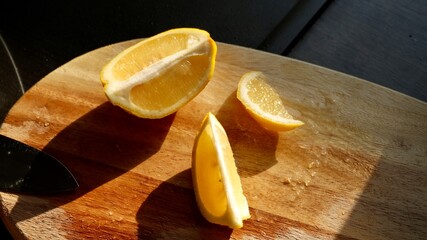Fresh lemon slices with ice cubes and mint leaves on a wooden surface. Ideal image for summer...