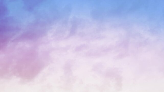 Clouds Moving Across a Sunset Sky 4K Loop features clouds moving across the sky with sunset colors of yellow, red, and blue in a loop.