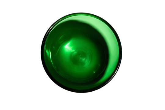 a green glass bowl with a white background
