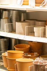 Mixed Terracotta, Ceramic and Metal Planters Displayed on Store Shelves