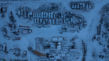 Aerial shot of snowy junkyard