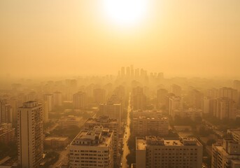 Aerial View of City Buildings Silhouetted by Hazy Sunlight and Air Pollution, Smog Over Urban Landscape