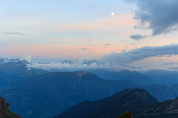 Mountain panorama with glaciers of mountain massif Grand Combin during sunset with clouds in Swiss...