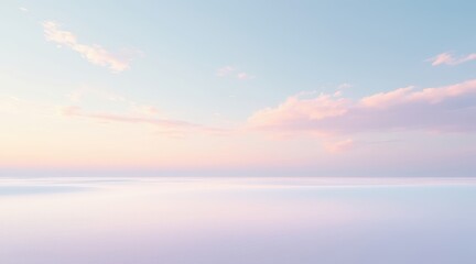 Obraz premium Serene pastel sky with soft clouds over a calm reflective landscape