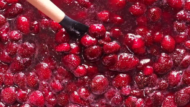 Fresh strawberries simmering for homemade jam